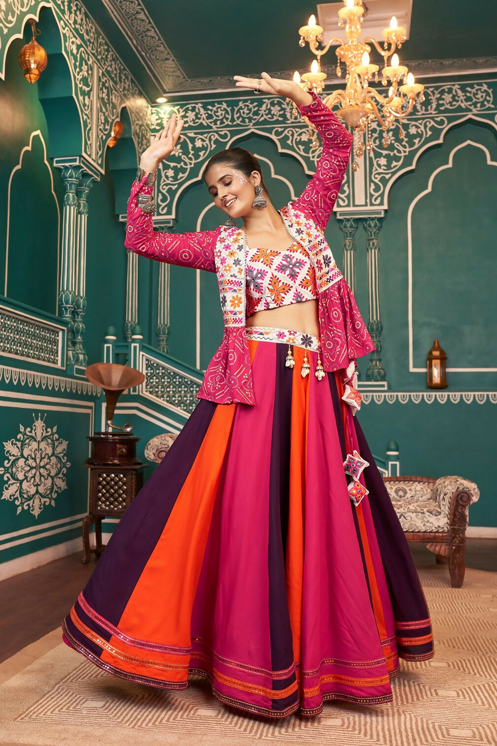 Woman wearing a vibrant multi-color viscose rayon Navratri lehenga choli with white dupatta