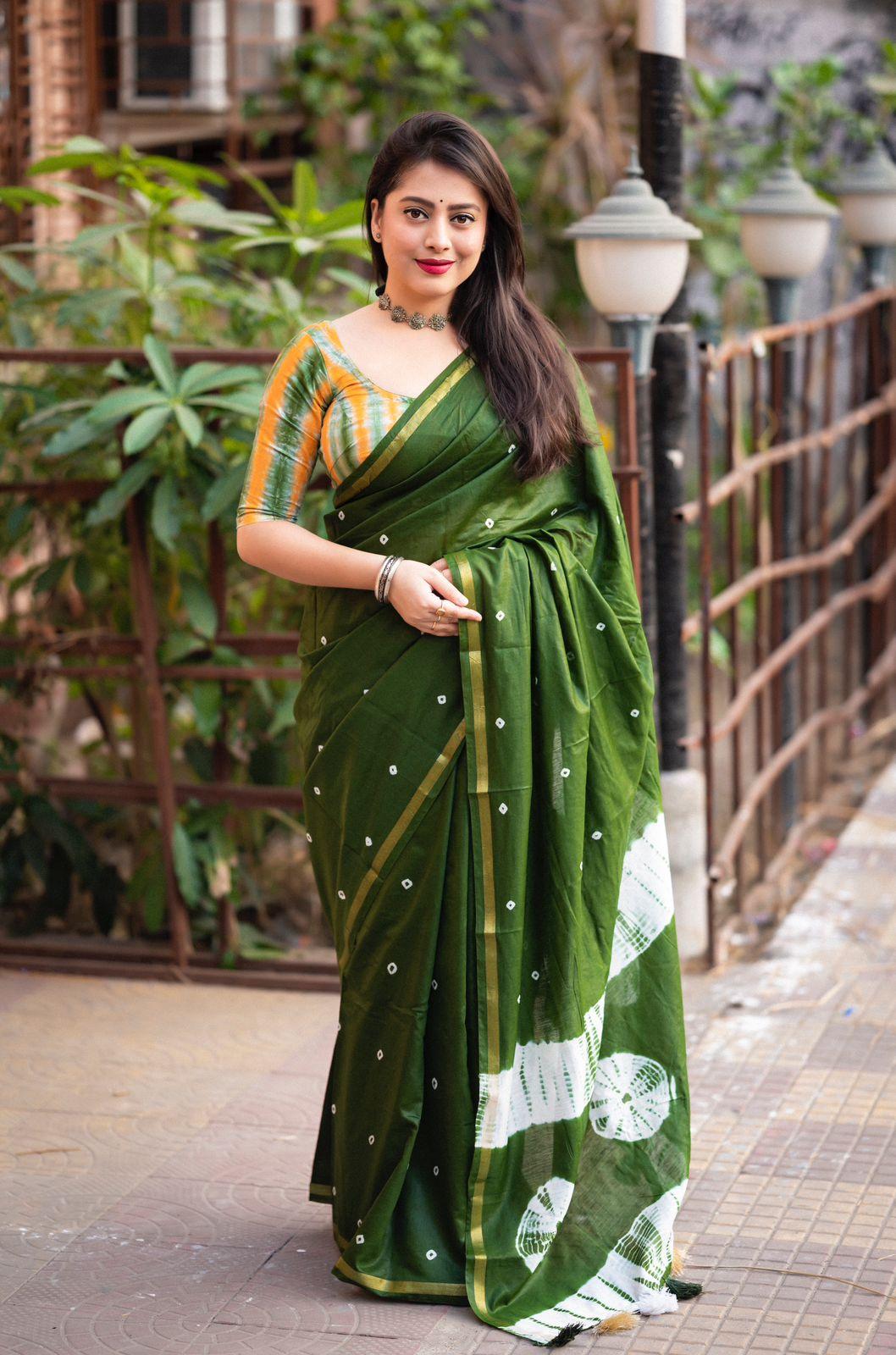 Mehndi green Chanderi cotton saree with intricate block print design and matching unstitched blouse