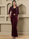 Elegant wine-colored velvet dress featuring detailed hand embellishments and three-quarter sleeves.