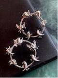 Bird motif oxidized stud earrings with black polish on brass