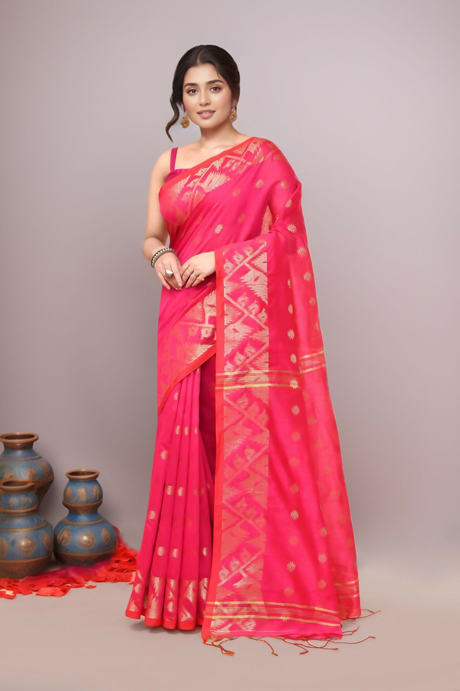 A beautiful pink cotton blend handloom saree with elegant drape and authentic texture.