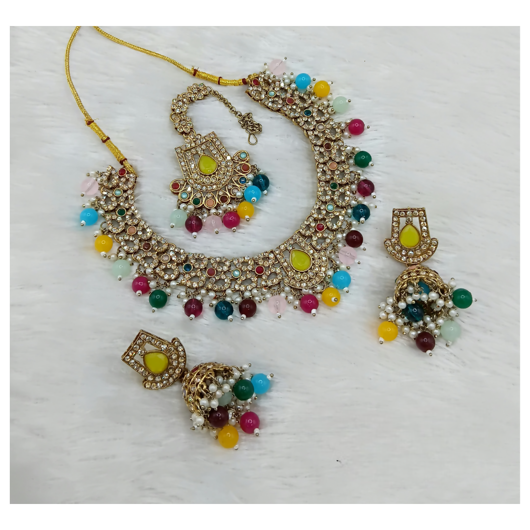 Multi-stone statement necklace set with matching drop earrings on a clean background