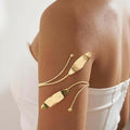 Golden alloy bohemian style kada bajuband armlet for women displayed on a neutral background