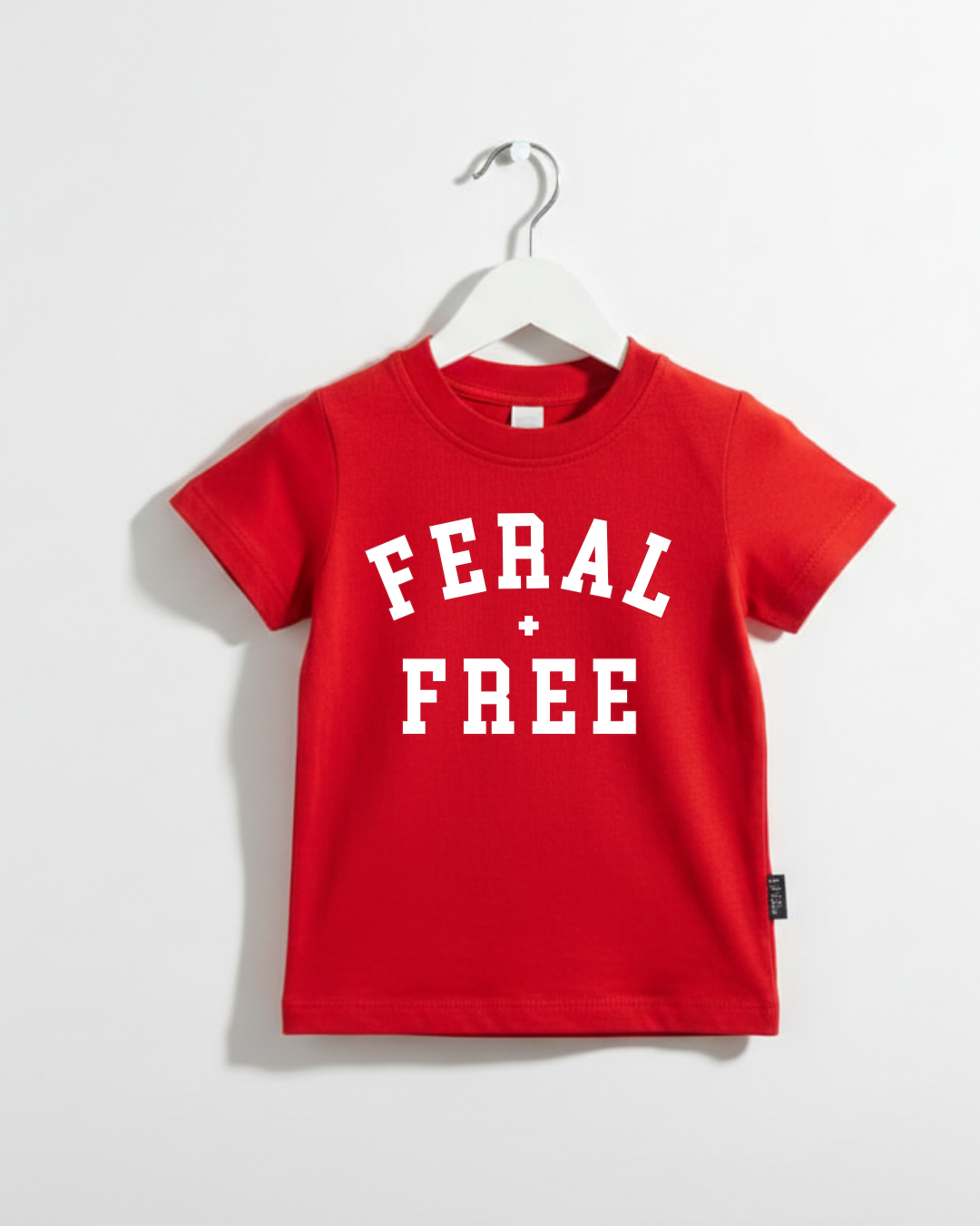 Unisex kids Feral + Free graphic tee in solid color, perfect for casual summer wear.