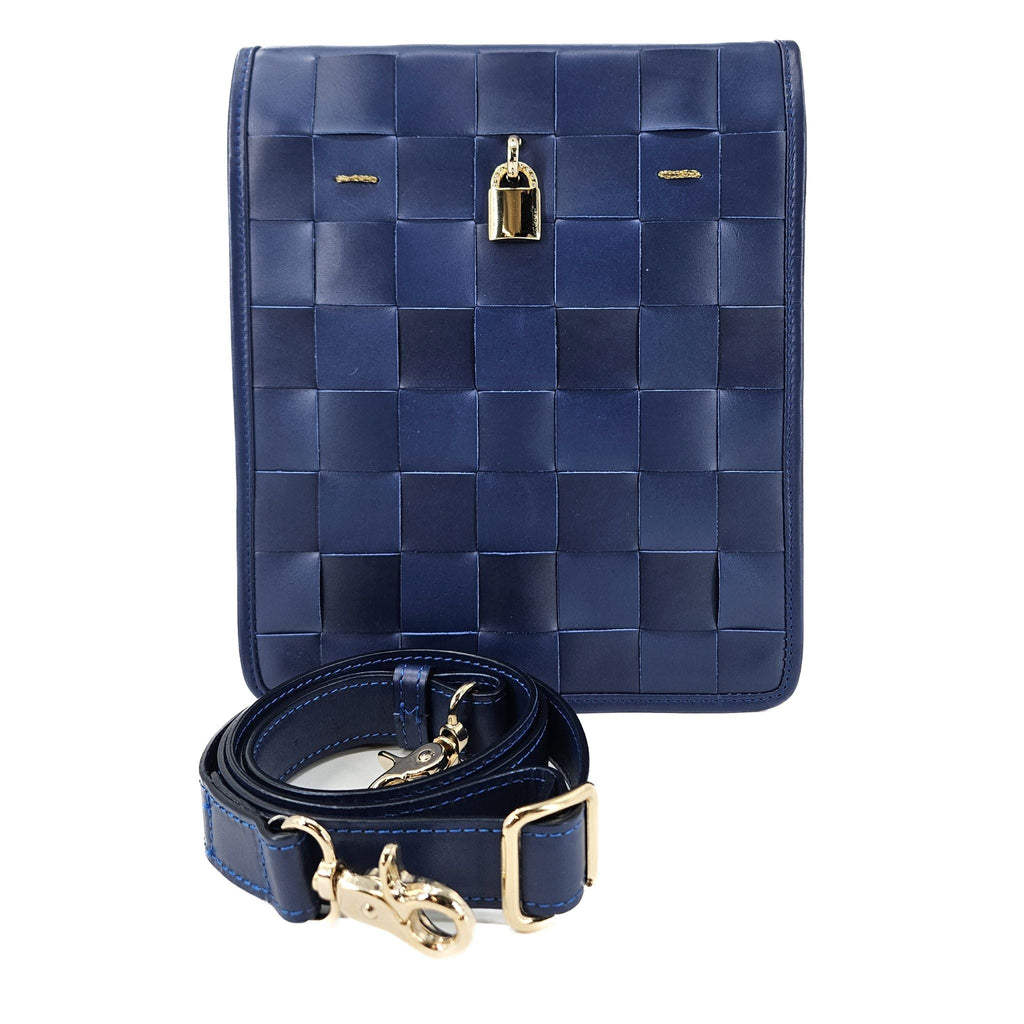 Navy blue woven leather crossbody bag with gold lock hardware and adjustable shoulder strap