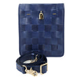 Navy blue woven leather crossbody bag with gold lock hardware and adjustable shoulder strap