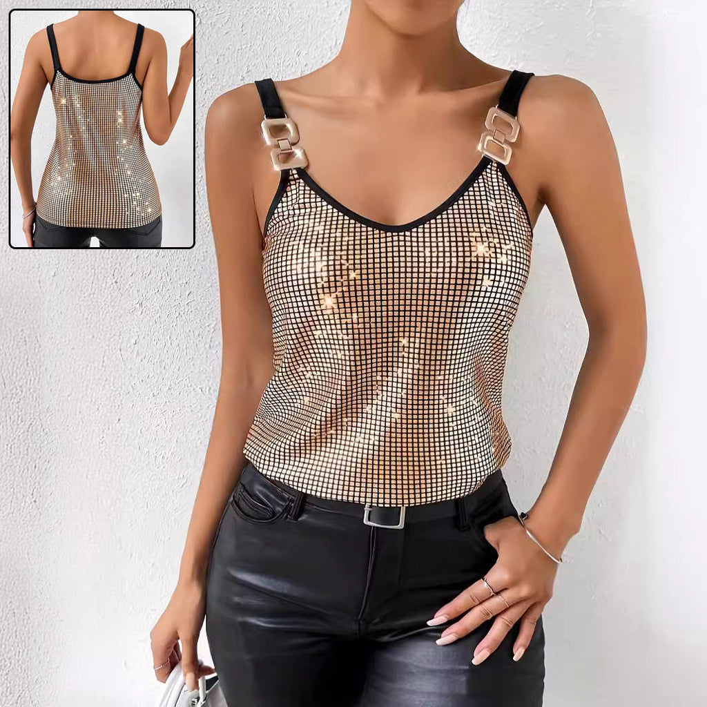 A woman wearing a gold sequined tank top with decorative chain shoulder straps, styled for an elegant evening look.