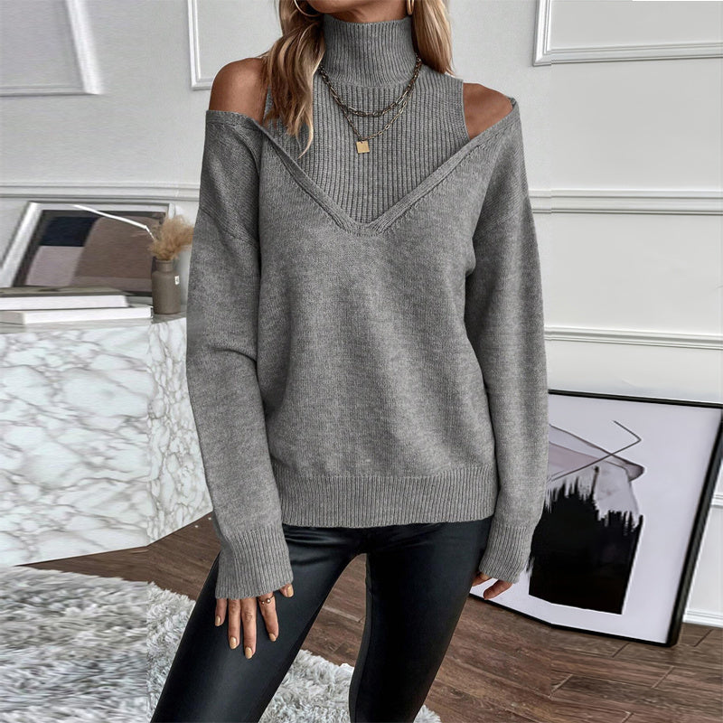 A woman wearing a stylish long sleeve off-shoulder turtleneck sweater in a grey colorway.