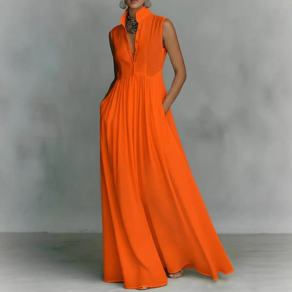 Model wearing a vibrant sleeveless maxi dress with a stand collar and deep v-neck in bright orange and red
