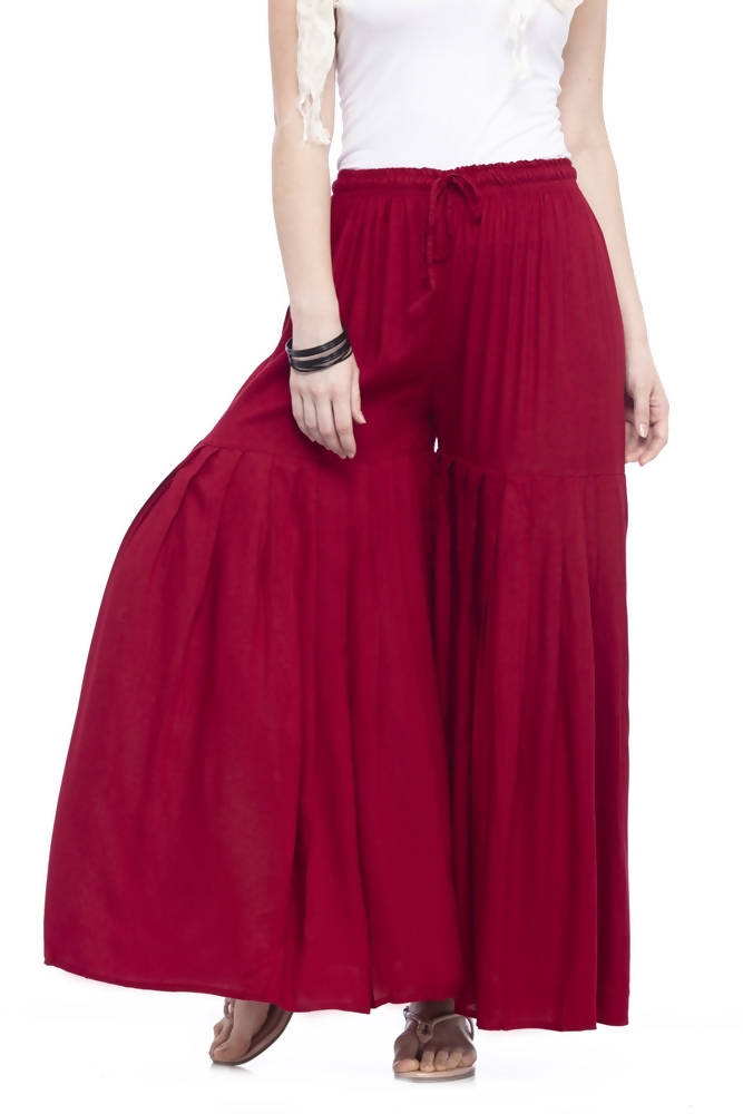 Plain maroon flared palazzo pants made from lightweight rayon cotton fabric