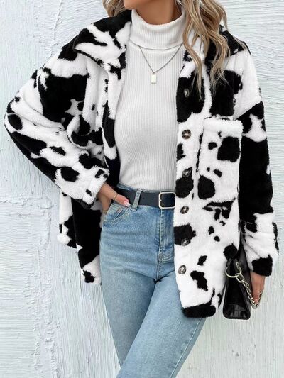 Black and white cow print fuzzy button-up jacket with a collar.