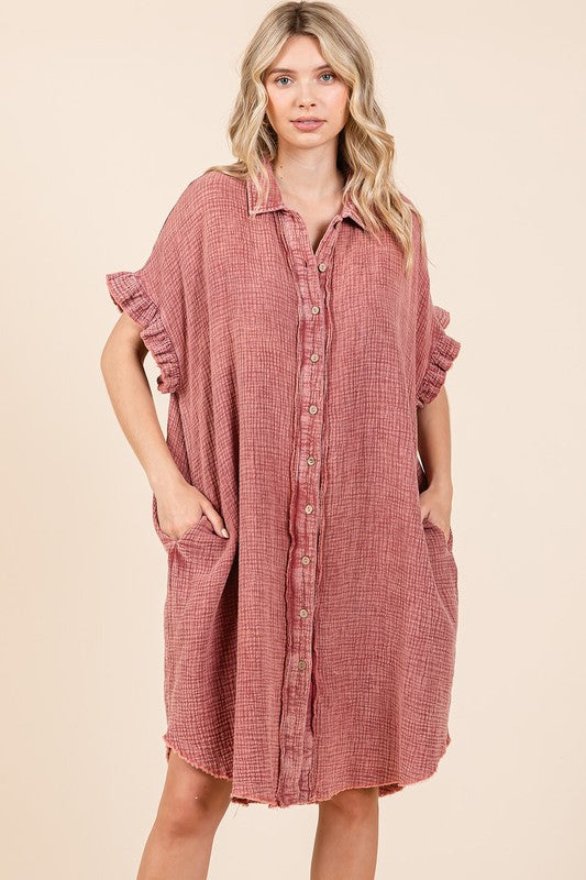 Woman wearing a lightweight mineral wash cotton gauze mini shirt dress with ruffle sleeve details.
