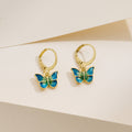 Petite gold butterfly earrings with dripping-oil detail, French-Korean design.