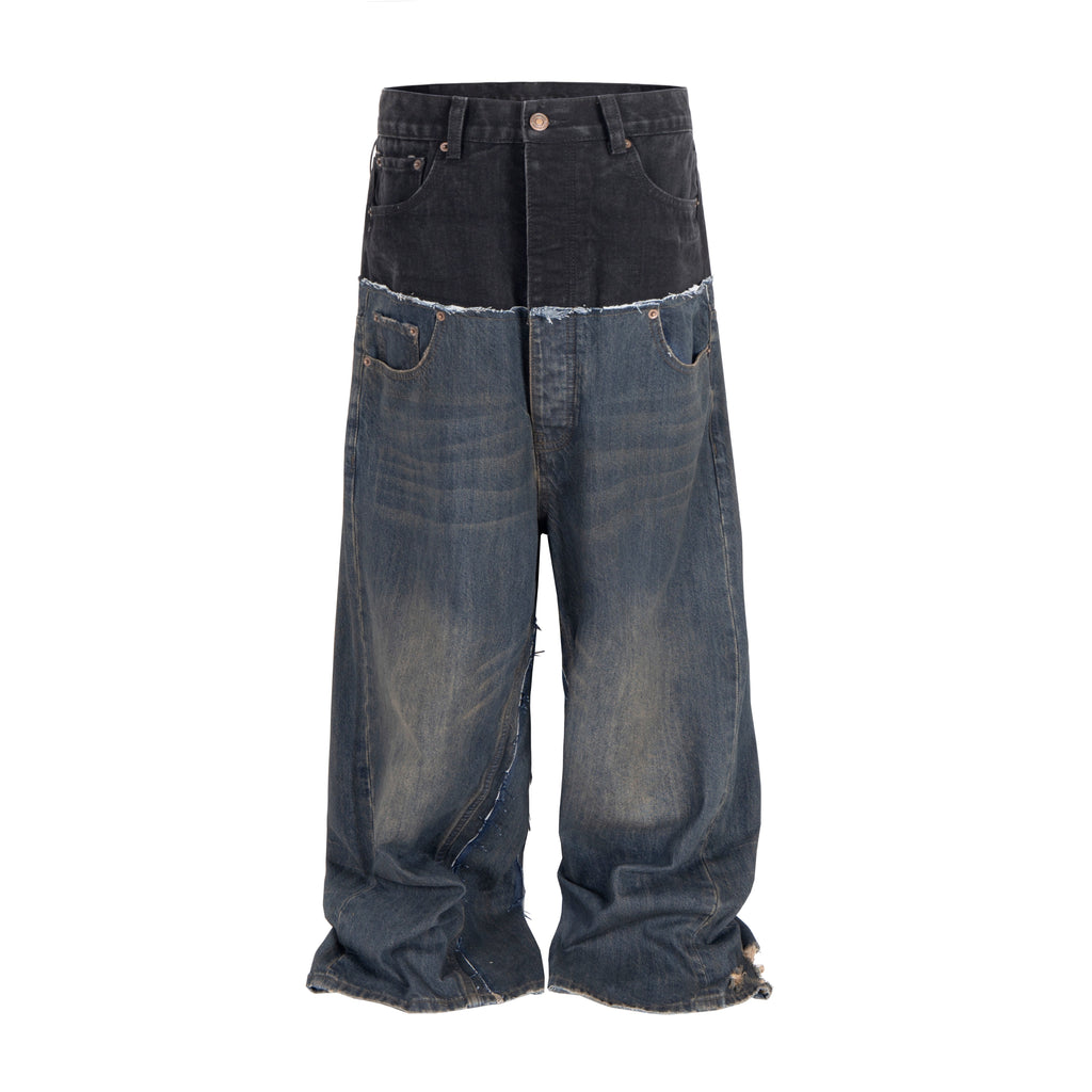 Front view of Wideboy Midnight Double Denim pants with a black top panel and distressed blue lower legs.