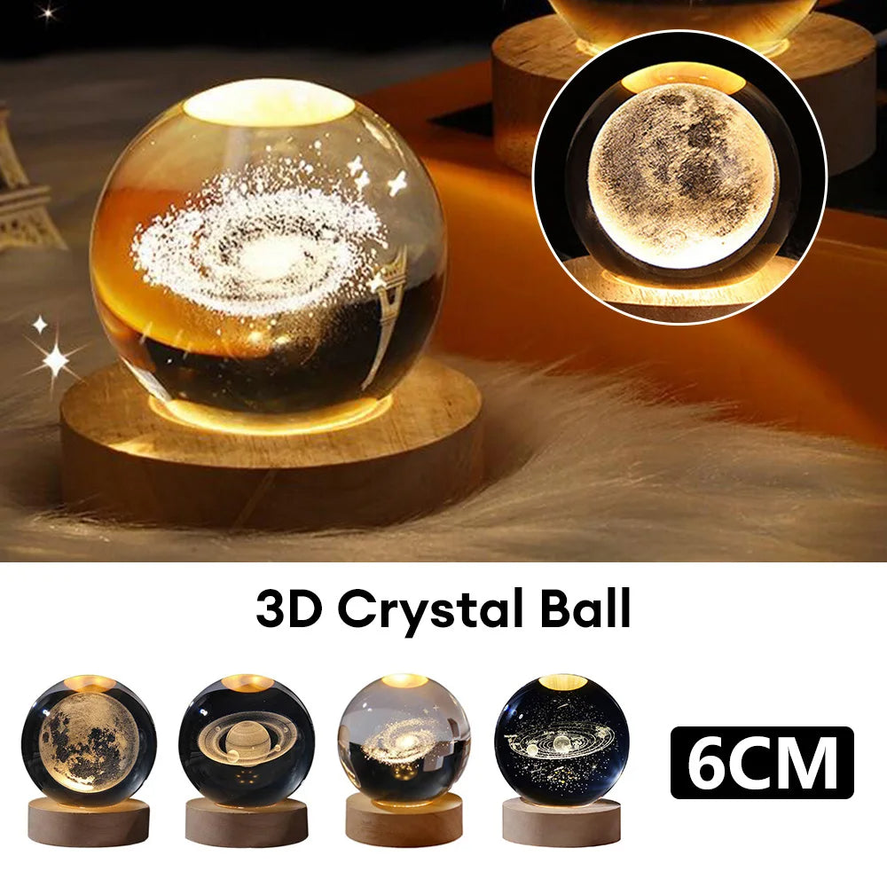3D crystal ball night lamp glowing with solar system projection on a dark surface