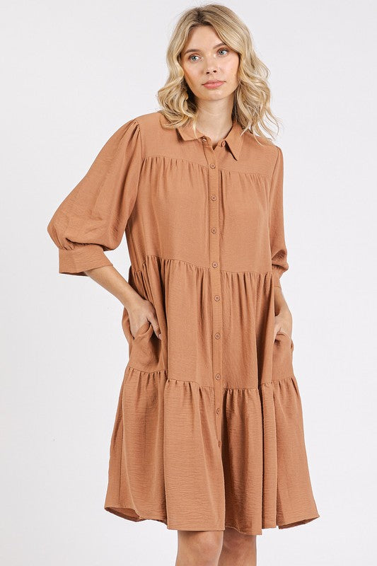 Classic collared shirt dress in tan with tiered skirt and button-down front.