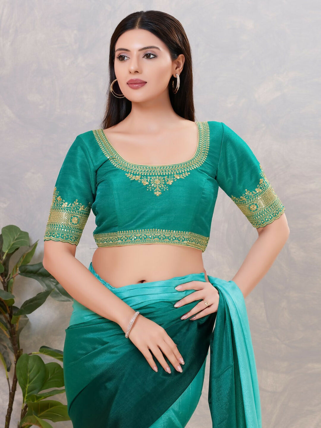 Vibrant Rama-Green silk stitched blouse with a round neck