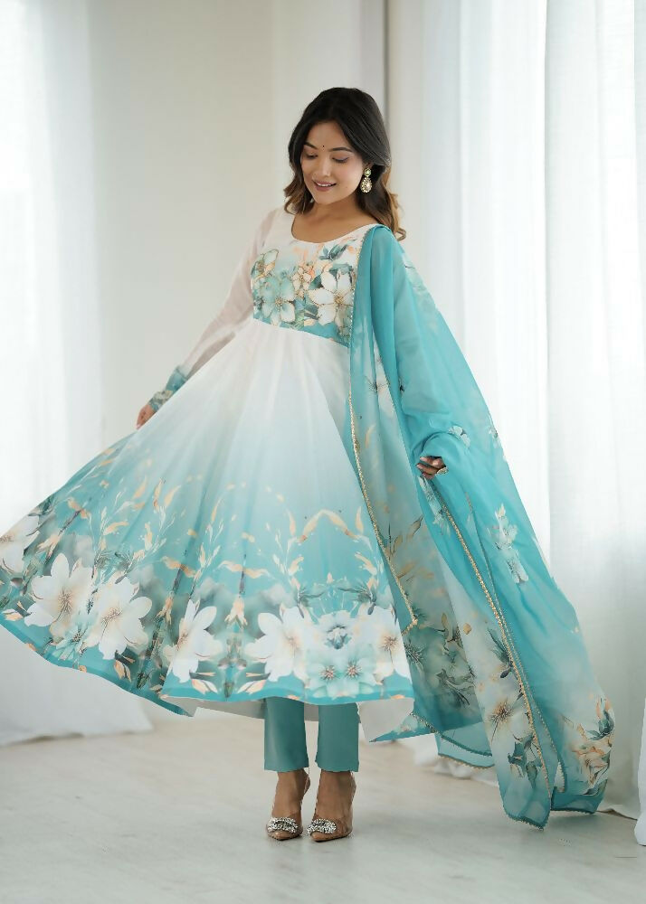 Aqua blue organza kurta with sequin embroidery paired with comfortable cotton trousers