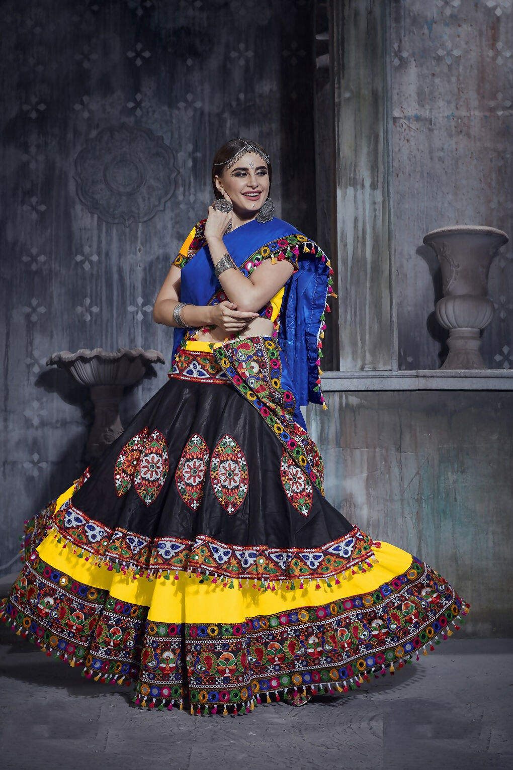 Black and yellow art silk Navratri lehenga choli set with a blue dupatta