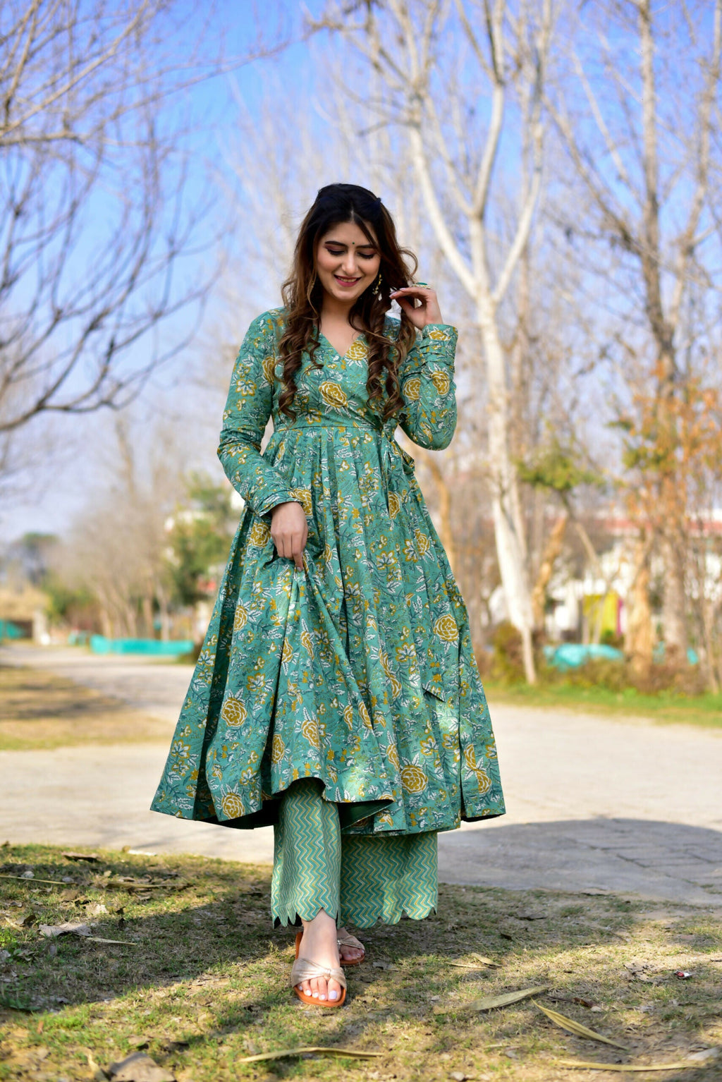 Women wearing a Sea Green Cotton Silk kurta and plazo set with heavy digital print and flared hem