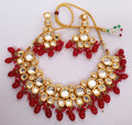 Rich maroon Kundan work necklace set with gold plating