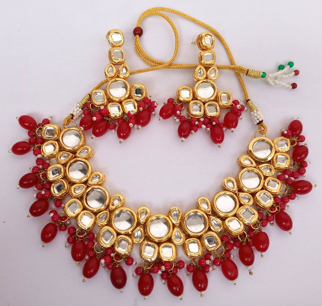 Rich maroon Kundan work necklace set with gold plating