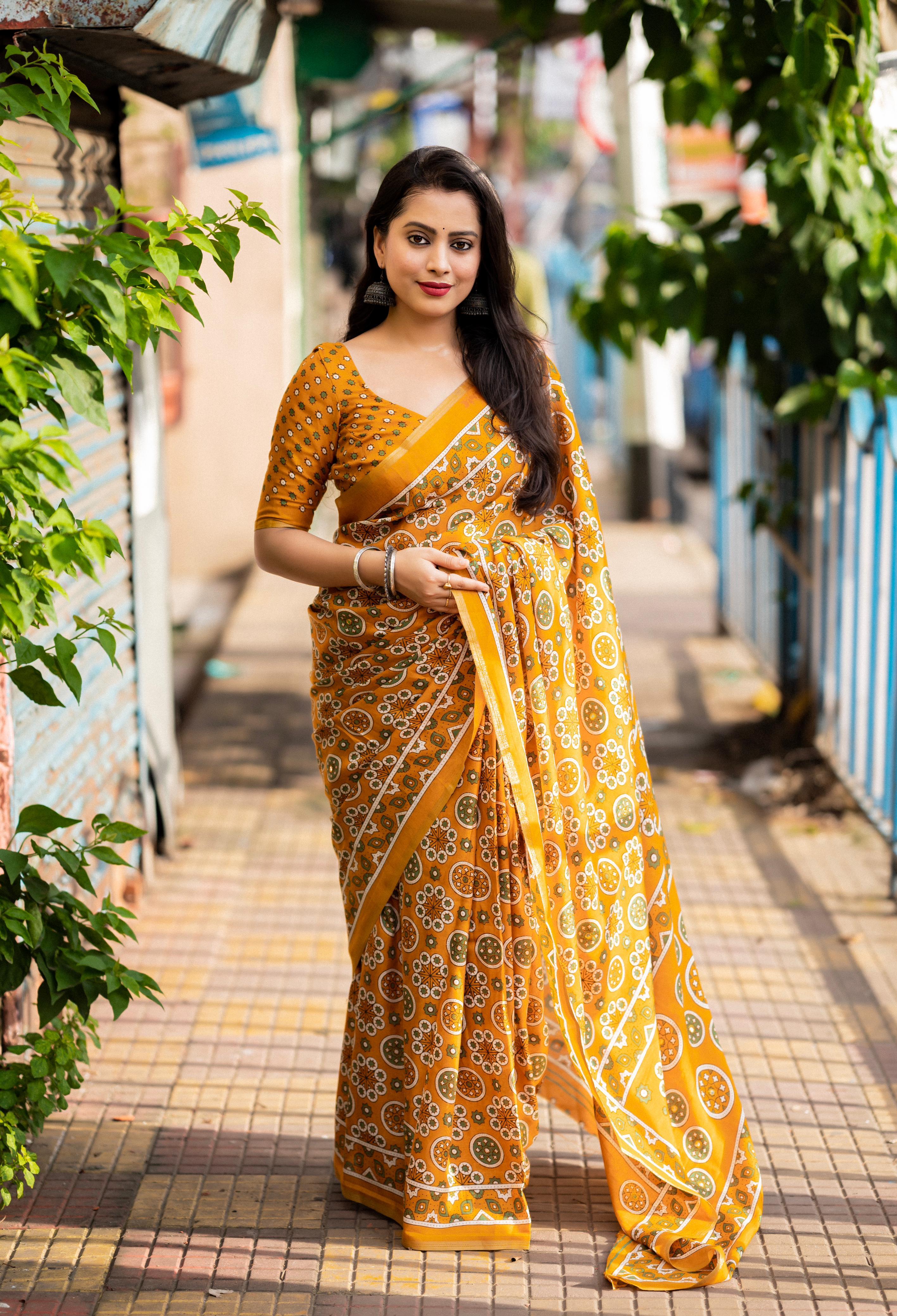 Mustard Cotton Blend Ajrak Saree with zari woven border and matching unstitched blouse piece
