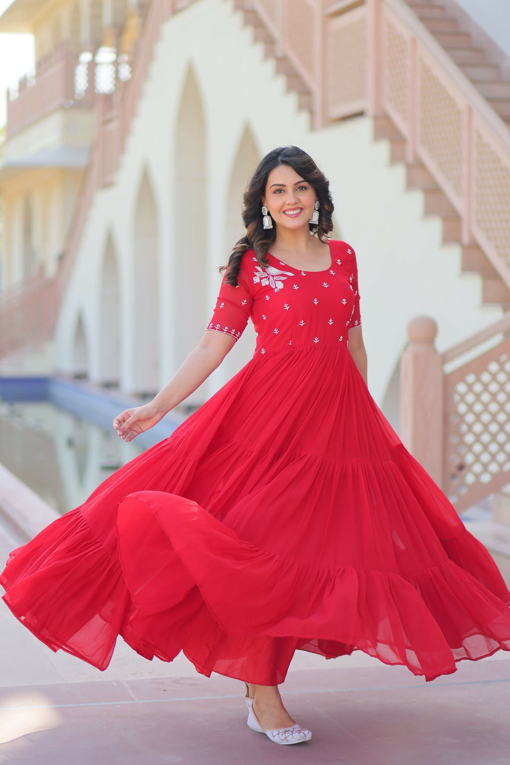 Red georgette gown featuring intricate sequence embroidery