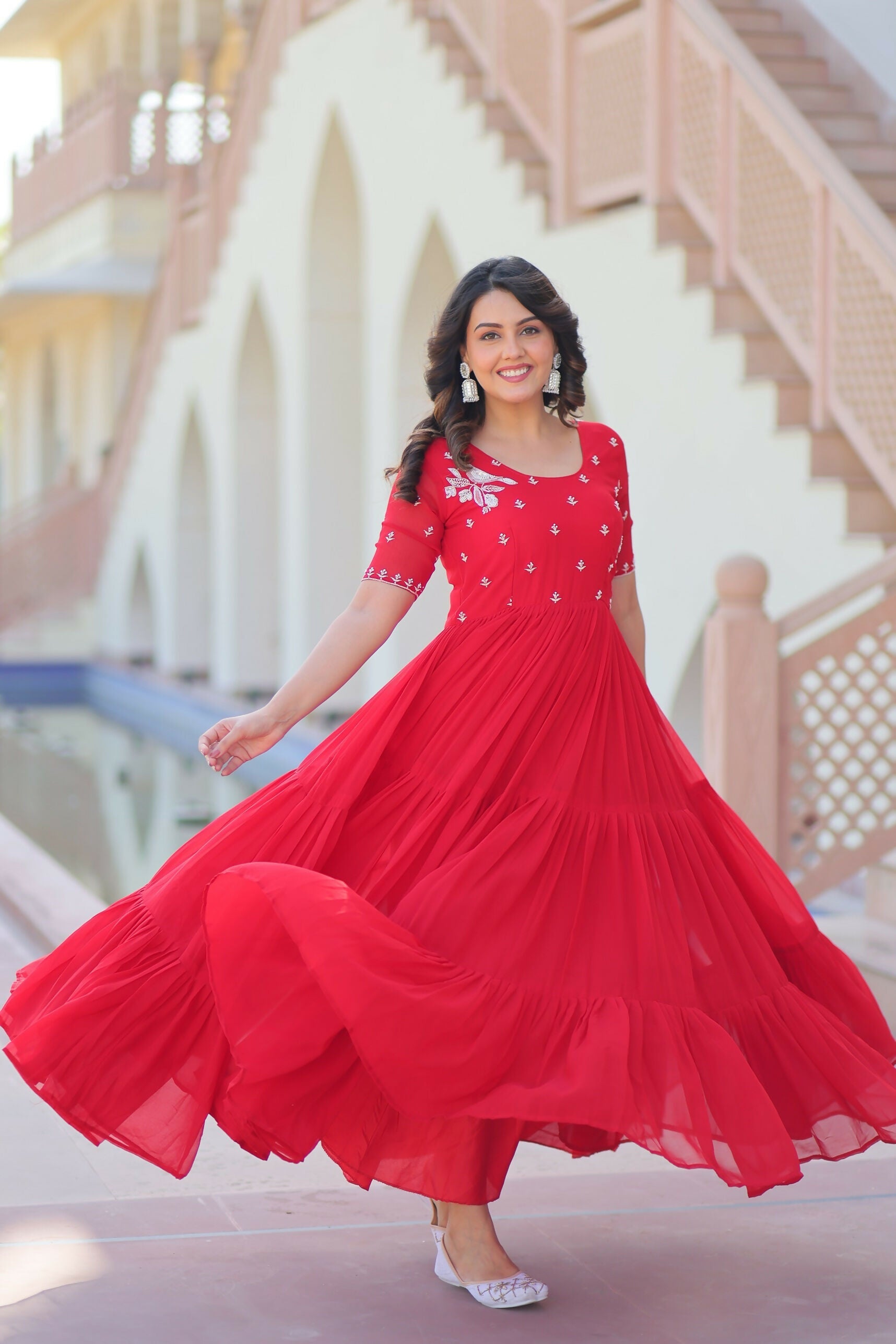 Red georgette gown featuring intricate sequence embroidery