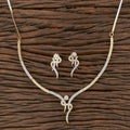 Golden White AD necklace set crafted from brass with white stones