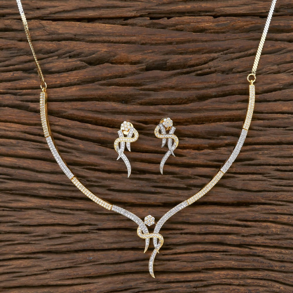Golden White AD necklace set crafted from brass with white stones