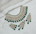 Stunning green stone and pearl necklace set with matching earrings and maang tikka