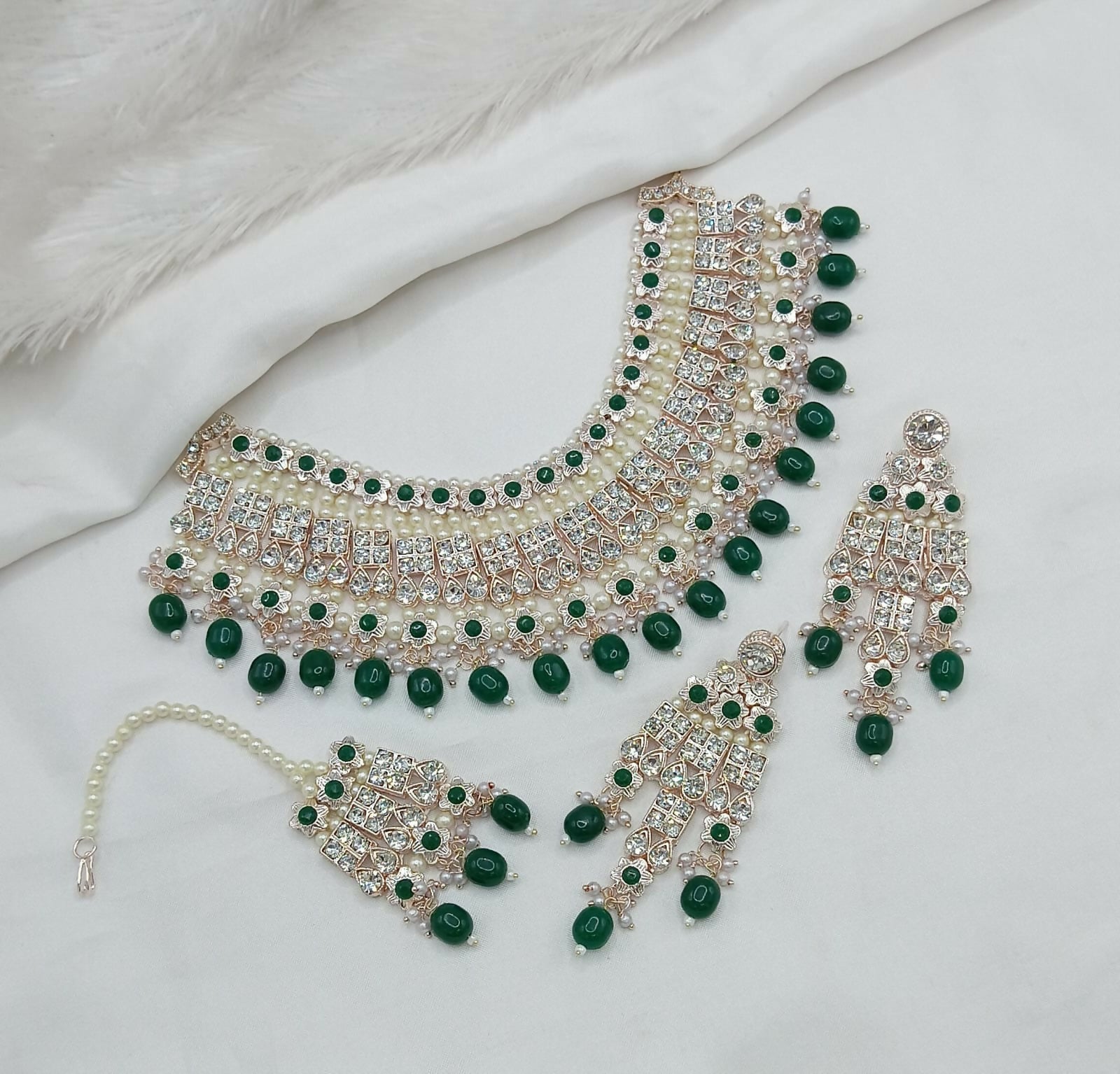 Stunning green stone and pearl necklace set with matching earrings and maang tikka