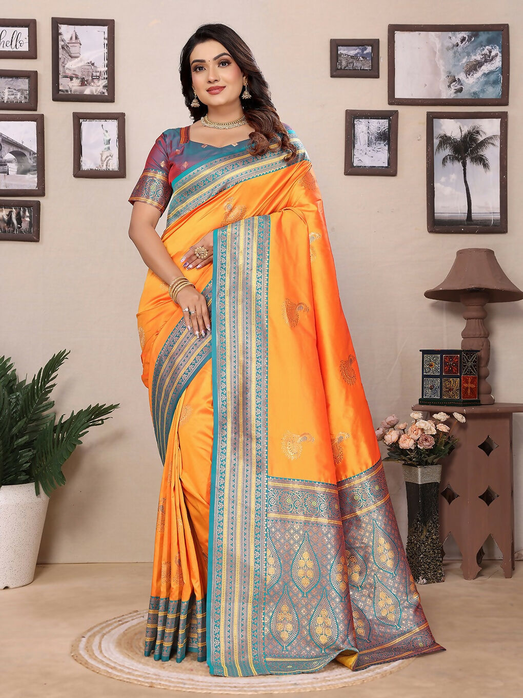 Orange Banarasi soft silk saree with small woven butti pattern and matching blouse piece.