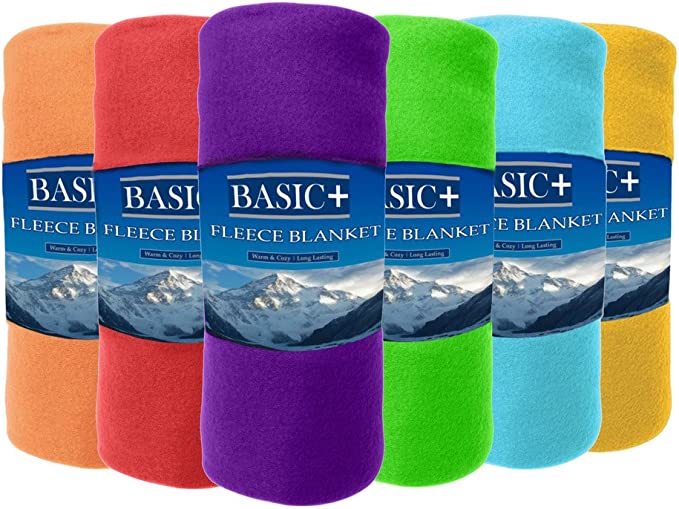 A soft premium polyester fleece throw blanket draped over a chair, representing cozy home comfort.