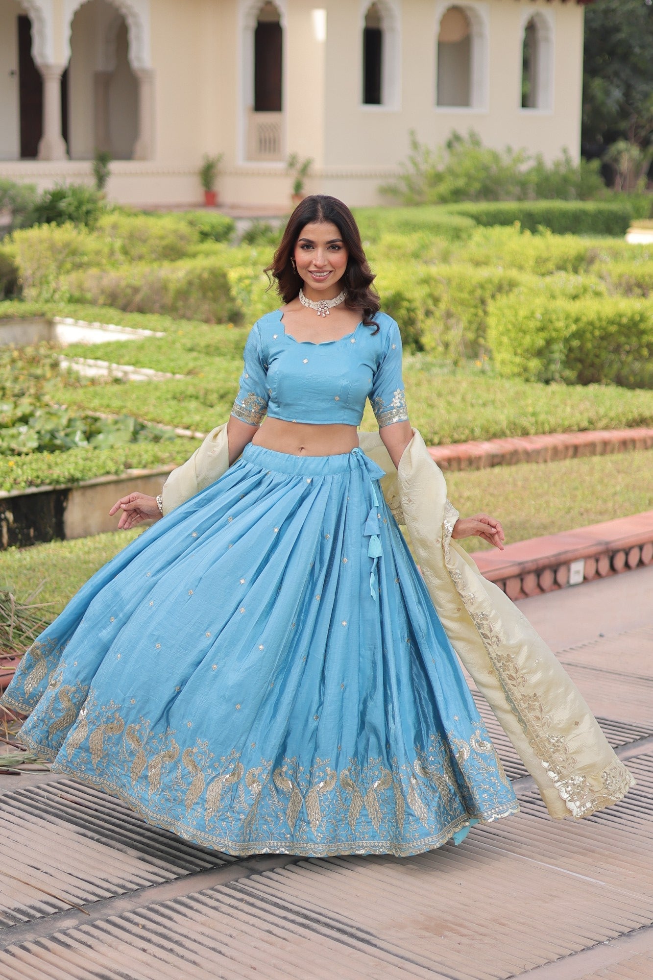 Skyblue gold crush lehenga choli with intricate sequins and zari embroidery and dori latkan closure