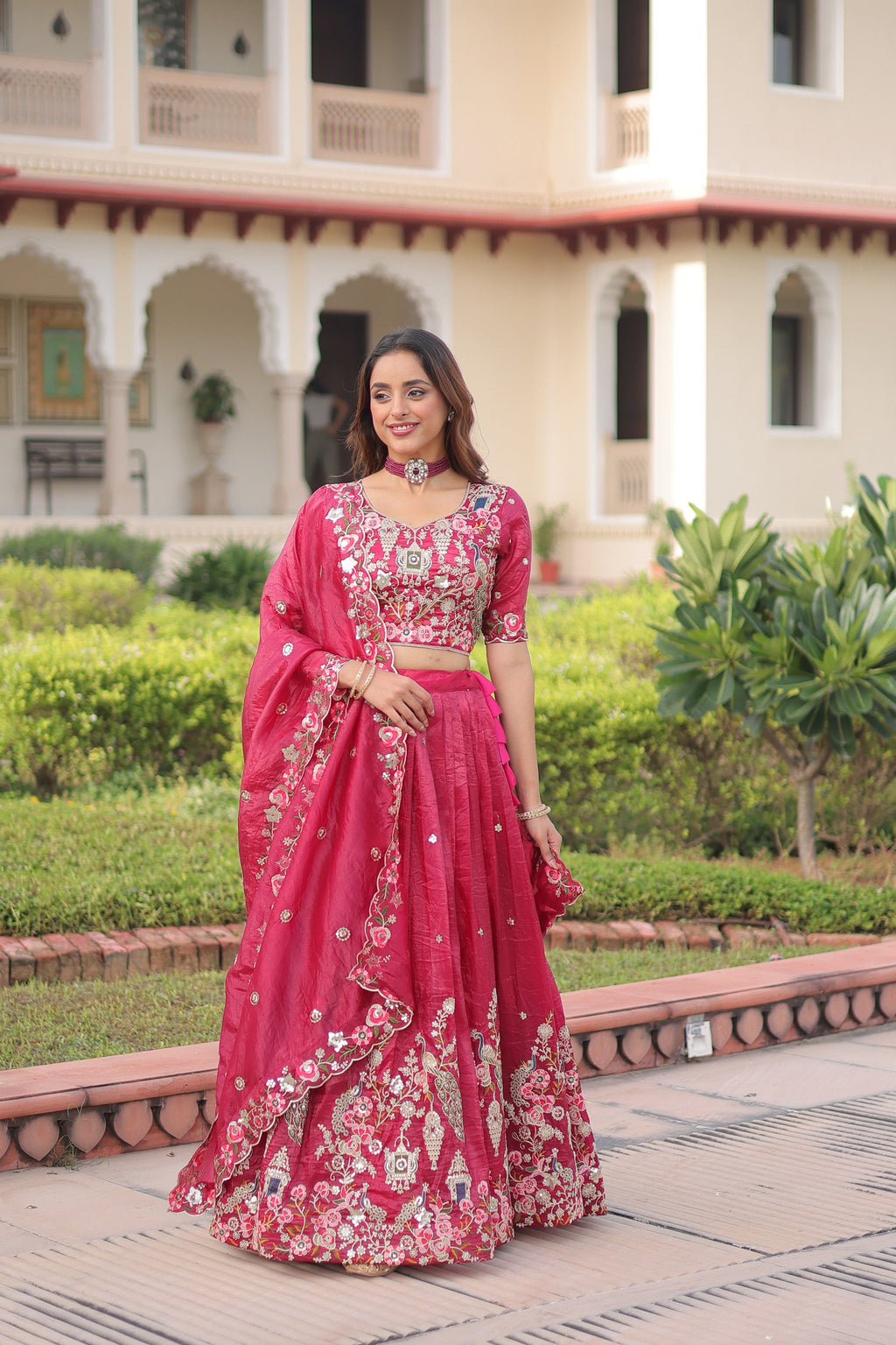 A beautiful pink gold crush lehenga choli with intricate sequins, zari, and coding embroidery.