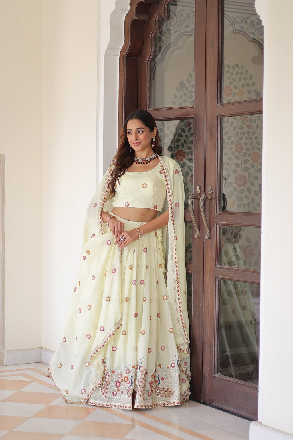 Cream Vichitra silk lehenga choli with multi-colored sequins, zari, and thread embroidery work