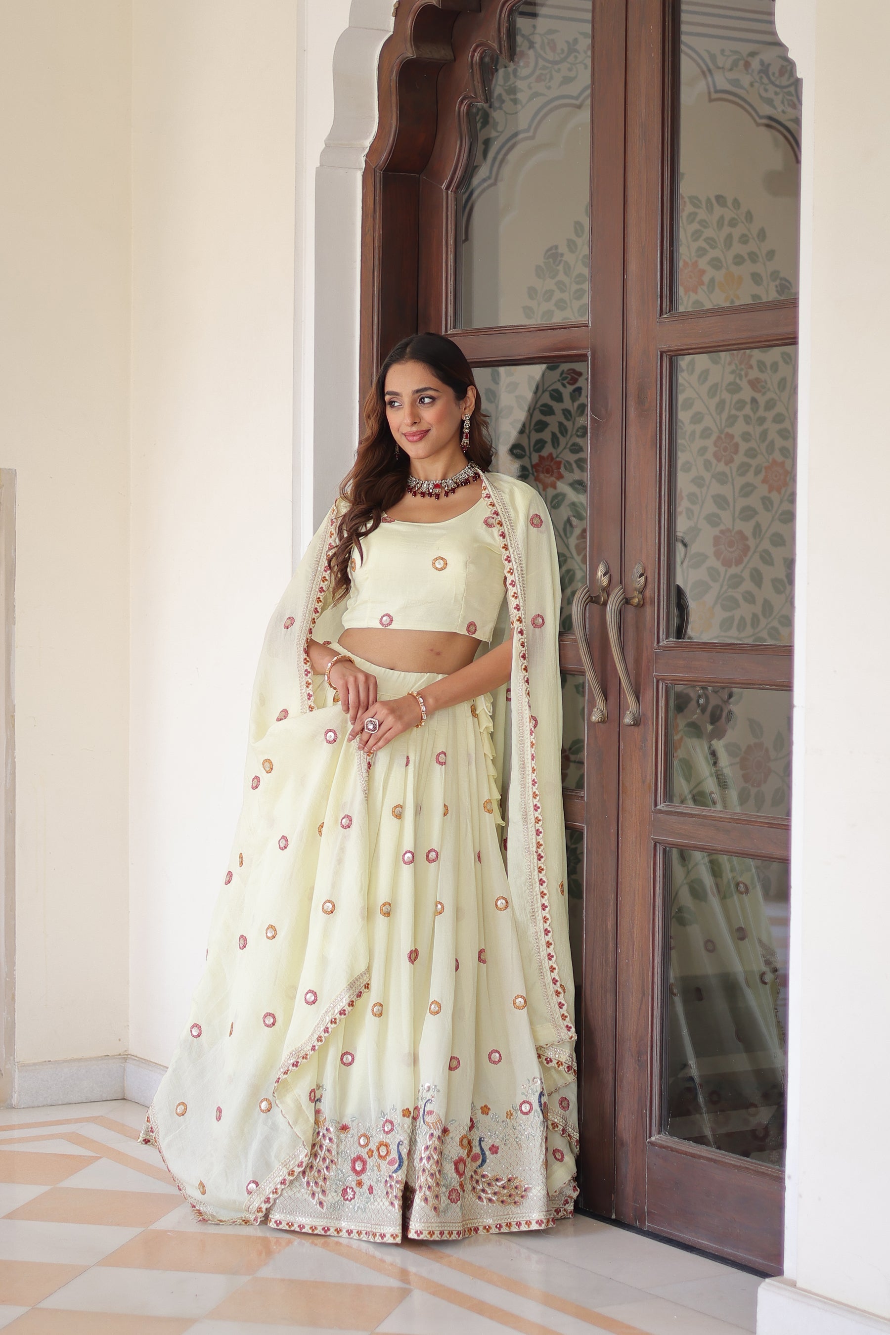 Cream Vichitra silk lehenga choli with multi-colored sequins, zari, and thread embroidery work