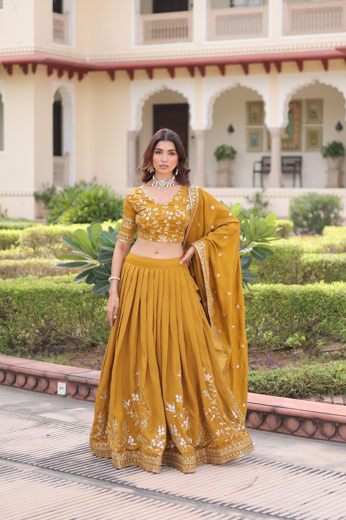 Beautiful yellow NC Vichitra silk lehenga choli with heavy zari and sequins embroidery.