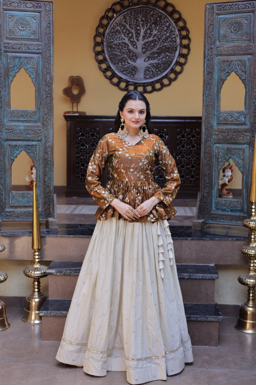 Offwhite Cosmos fabric lehenga choli featuring zari embroidery, sequins, and mirror lace work.