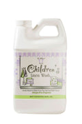 A 64 oz bottle of Le Blanc Linen Wash, a premium laundry cleaner for baby and household linens.