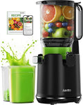 Black cold press juicer with a 5.3 inch wide feed chute on a kitchen counter.