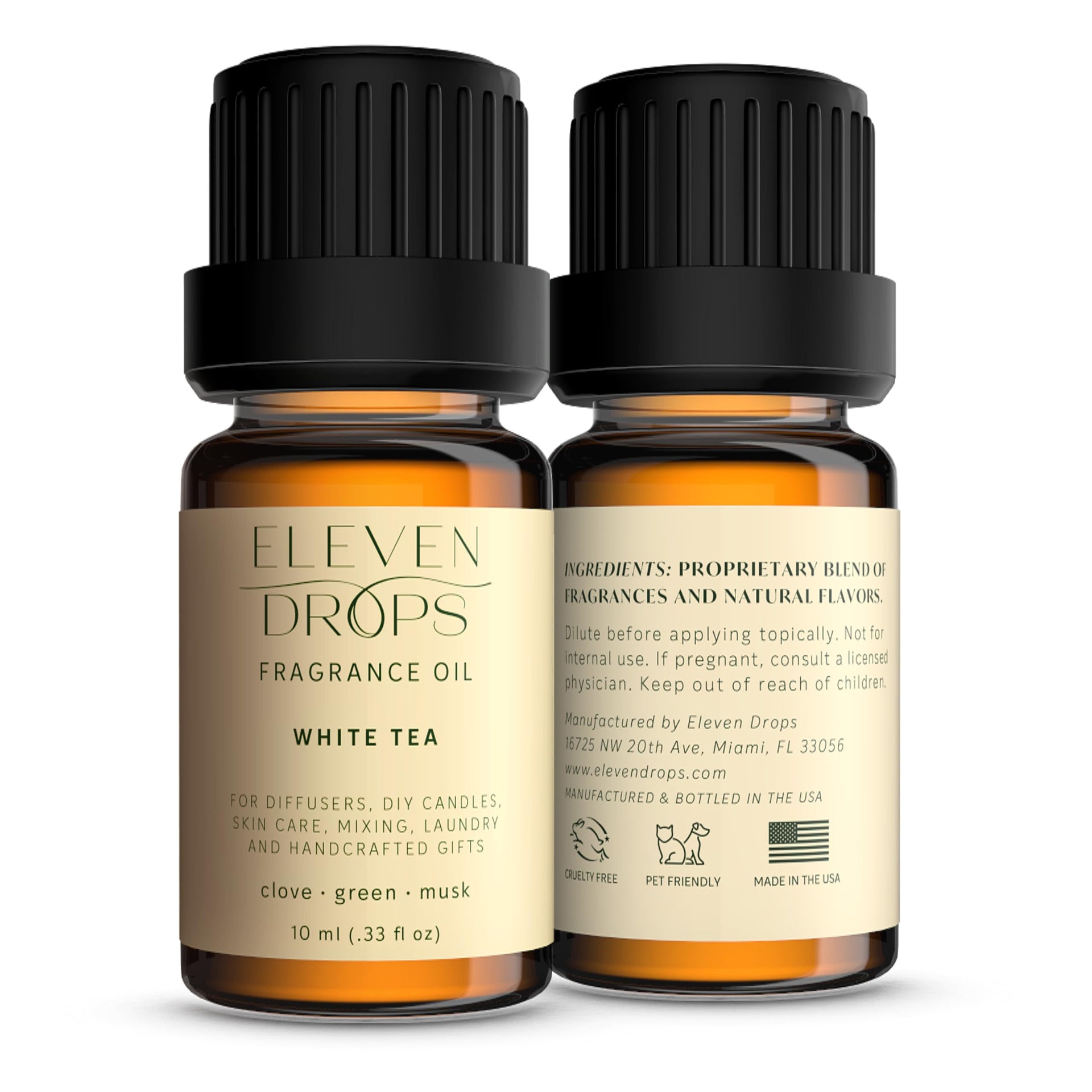 Amber glass bottles of White Tea fragrance oil with black caps and cream labels