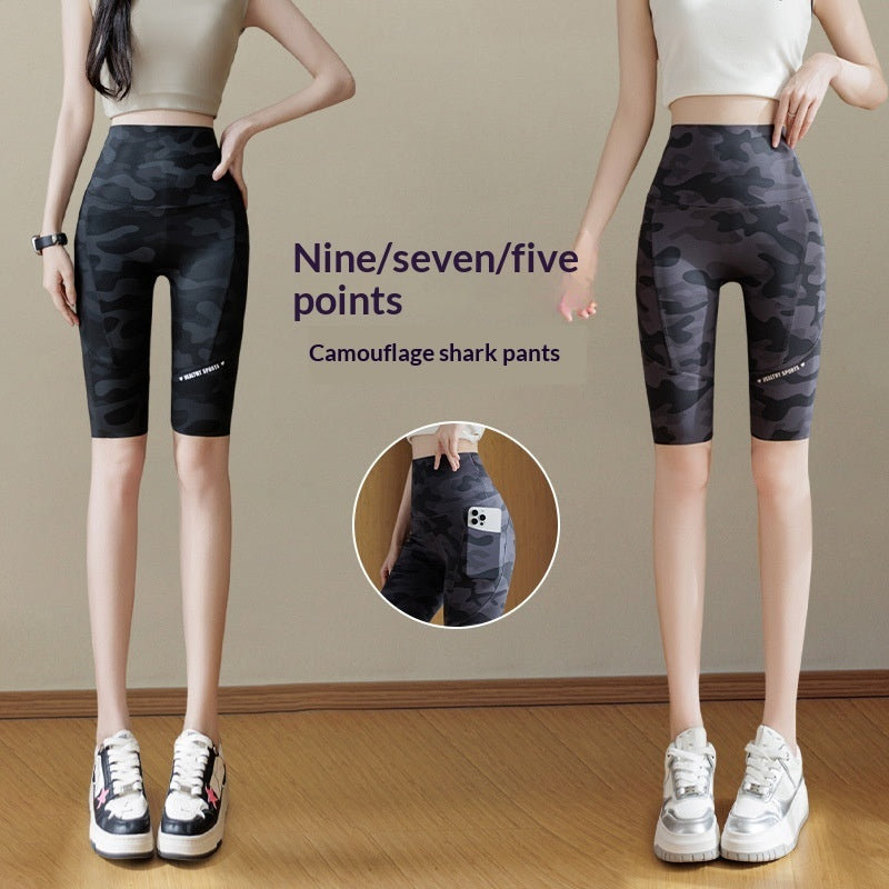 Women's camouflage shark print yoga pants with deep side pockets, slim-fit design.