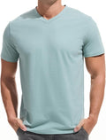 A man wearing a premium fitted modern V-neck t-shirt in a neutral color, showcasing the form-fitting cut.