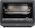 7-in-1 black steam convection oven with air fry and sous vide settings on a kitchen countertop.