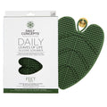 Minimalist green silicone body scrubber with suction cup attachment