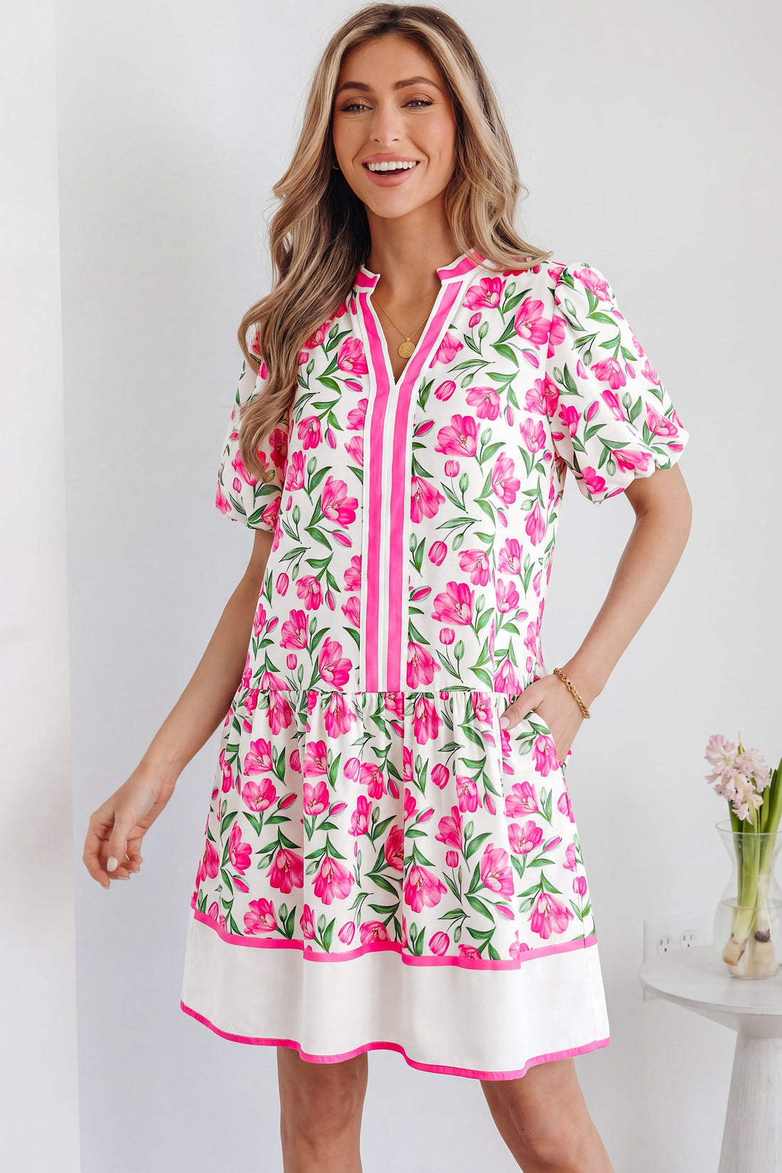 Aliya floral print short dress with puffy sleeves and bold color block trim