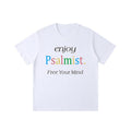 Front view of a white short-sleeve, loose-fit t-shirt featuring a multi-colored and black letter print that reads "enjoy Psalmist. Free Your Mind".